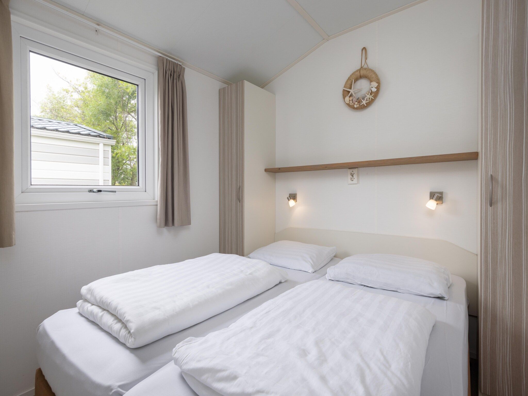 Een slaapkamer van Vakantiepark Callassande 4 in Callantsoog