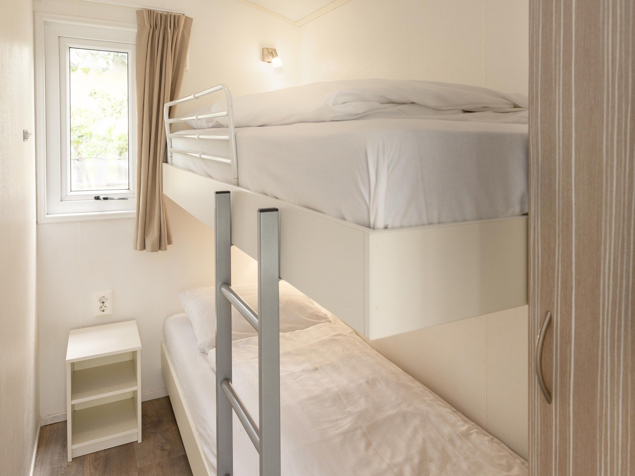 Een slaapkamer van Vakantiepark Callassande 4 in Callantsoog