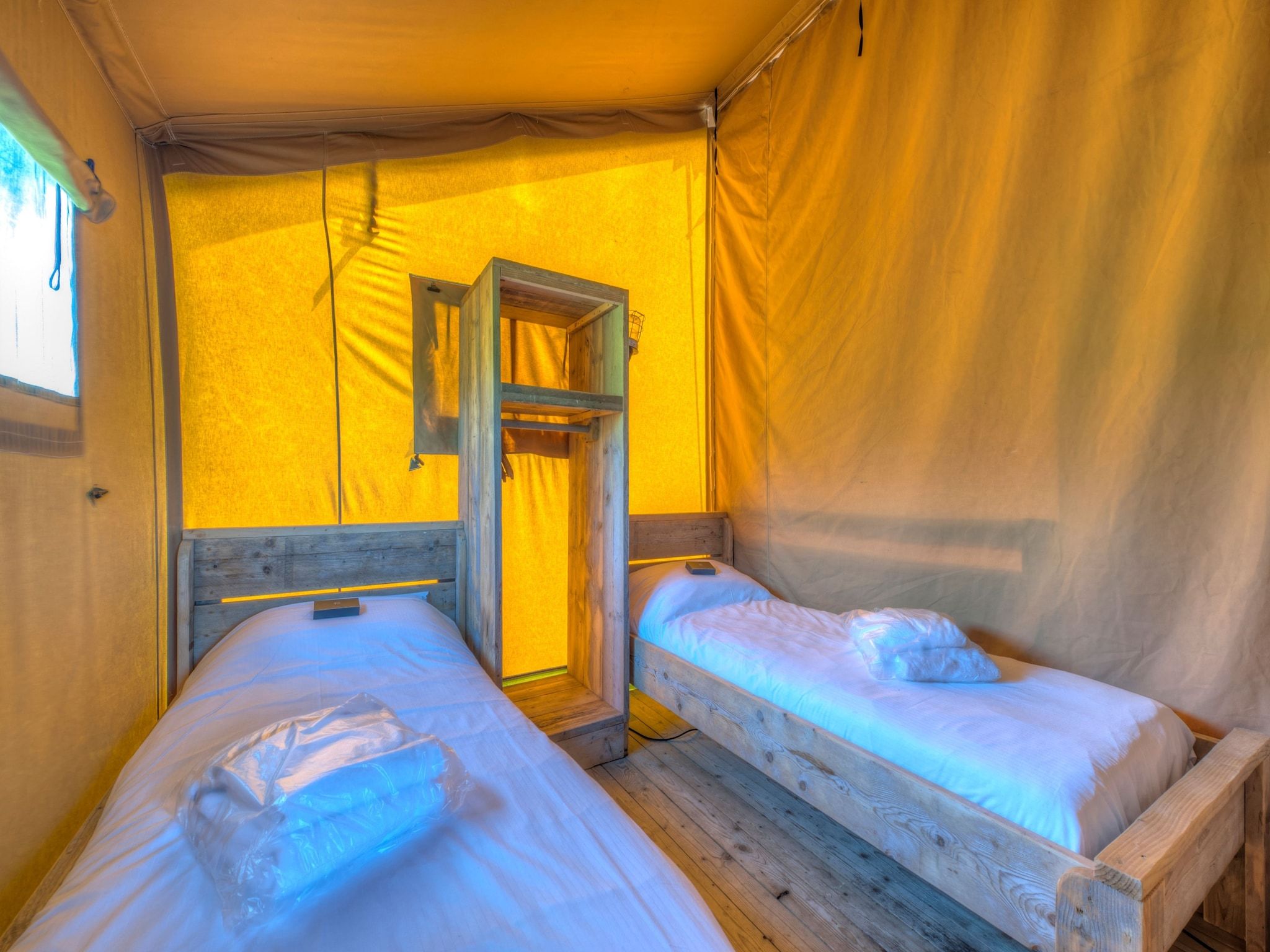 Een slaapkamer van Vakantiepark de Katjeskelder 19 in Oosterhout