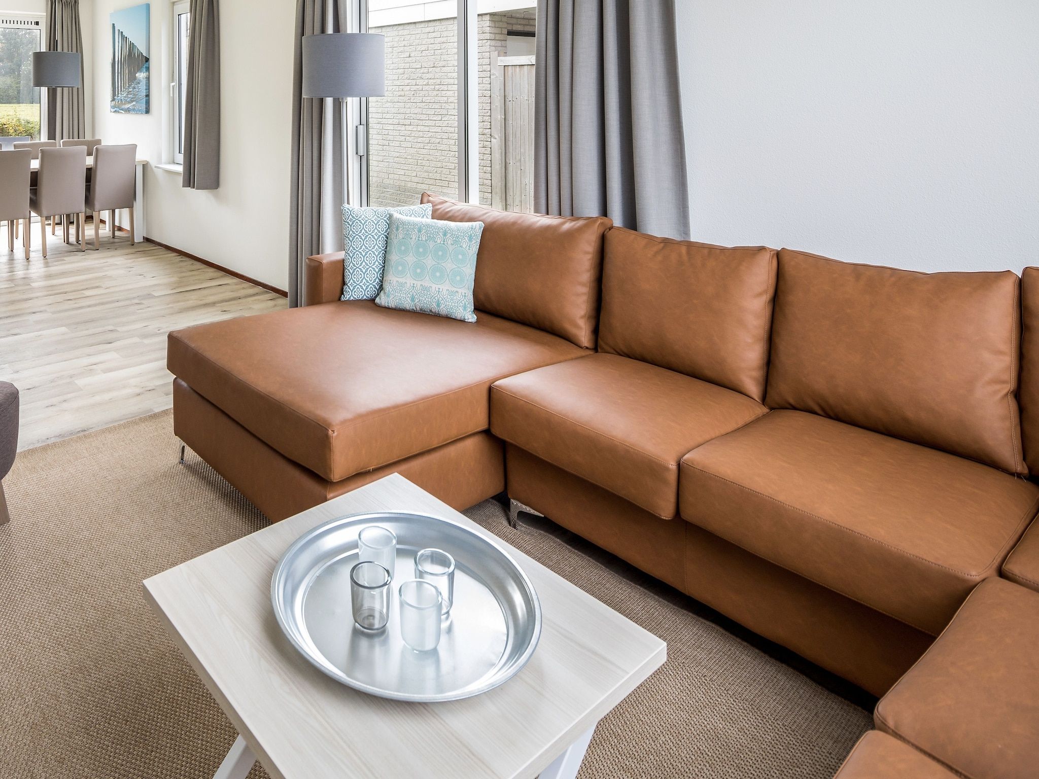 De woonkamer van Vakantiepark Zeeland Village 1 in Scharendijke