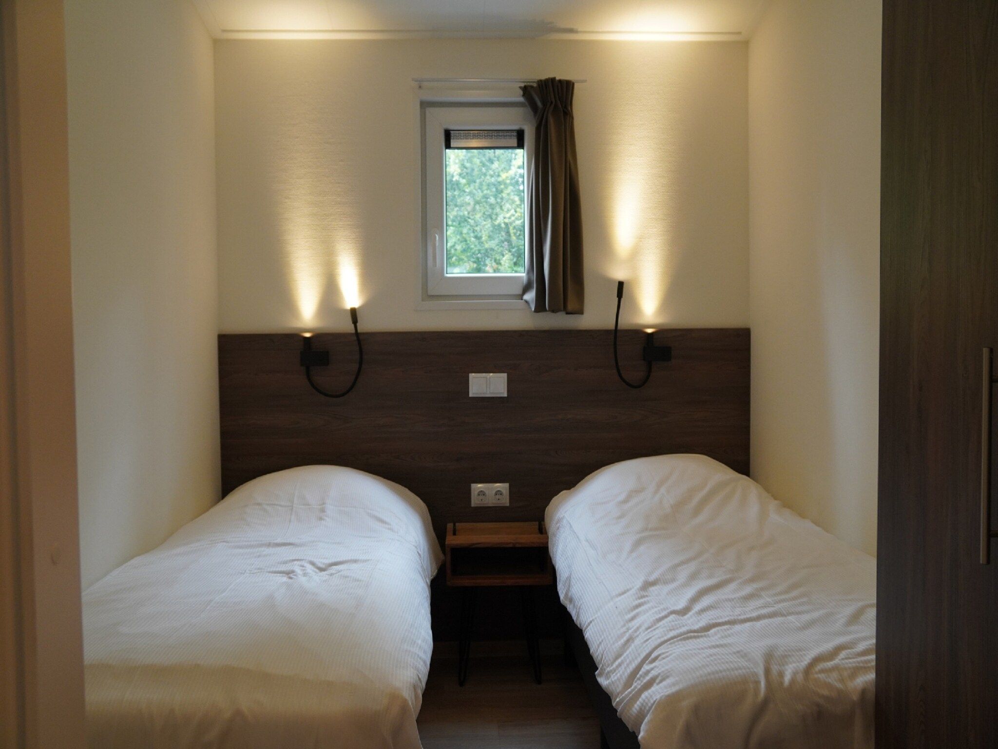 Een slaapkamer van Vakantiepark De Rimboe & De Woeste Hoogte 20 in Hoenderloo