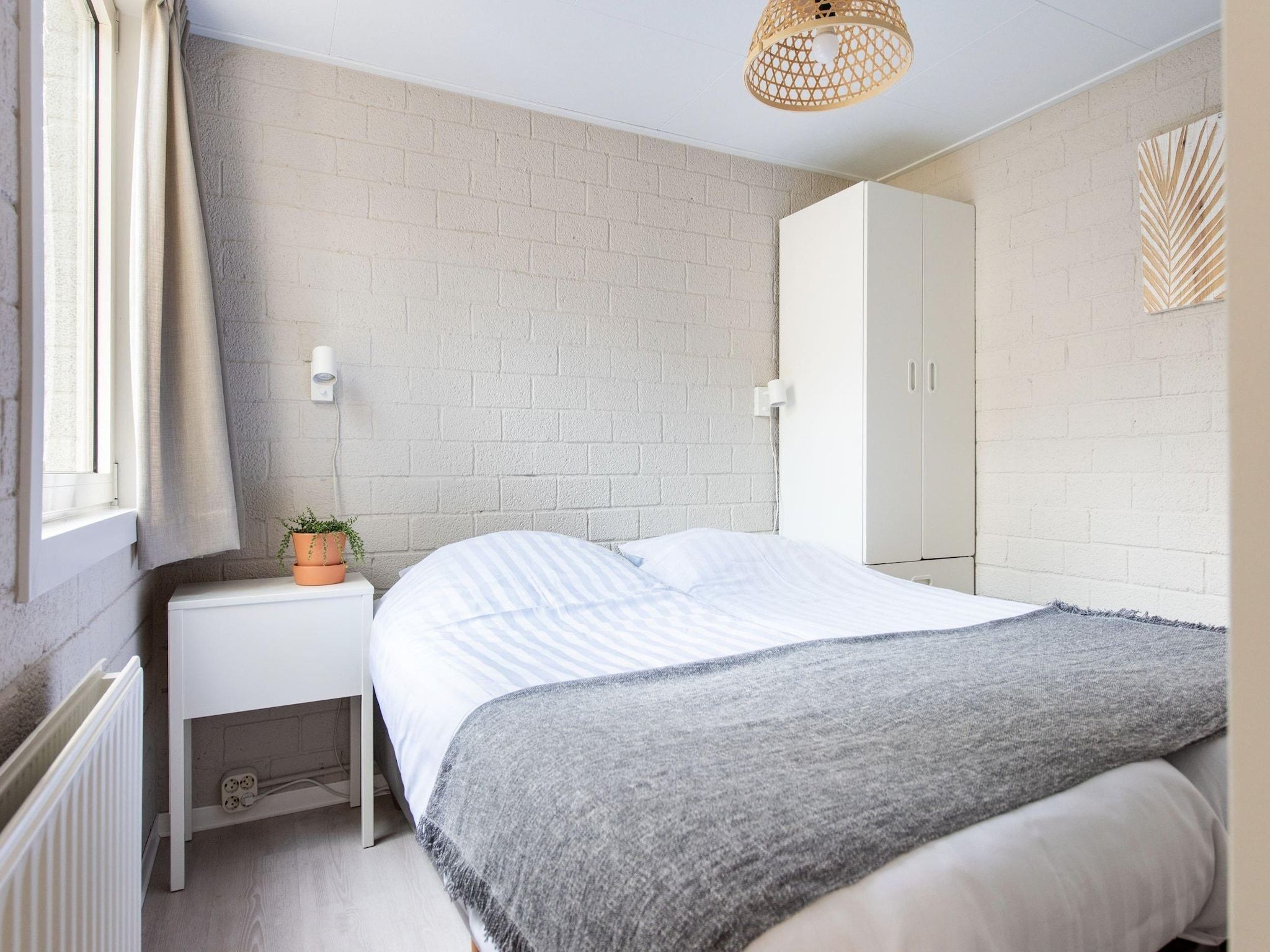 Een slaapkamer van Vakantiepark de Berkenhorst 10 in Kootwijk