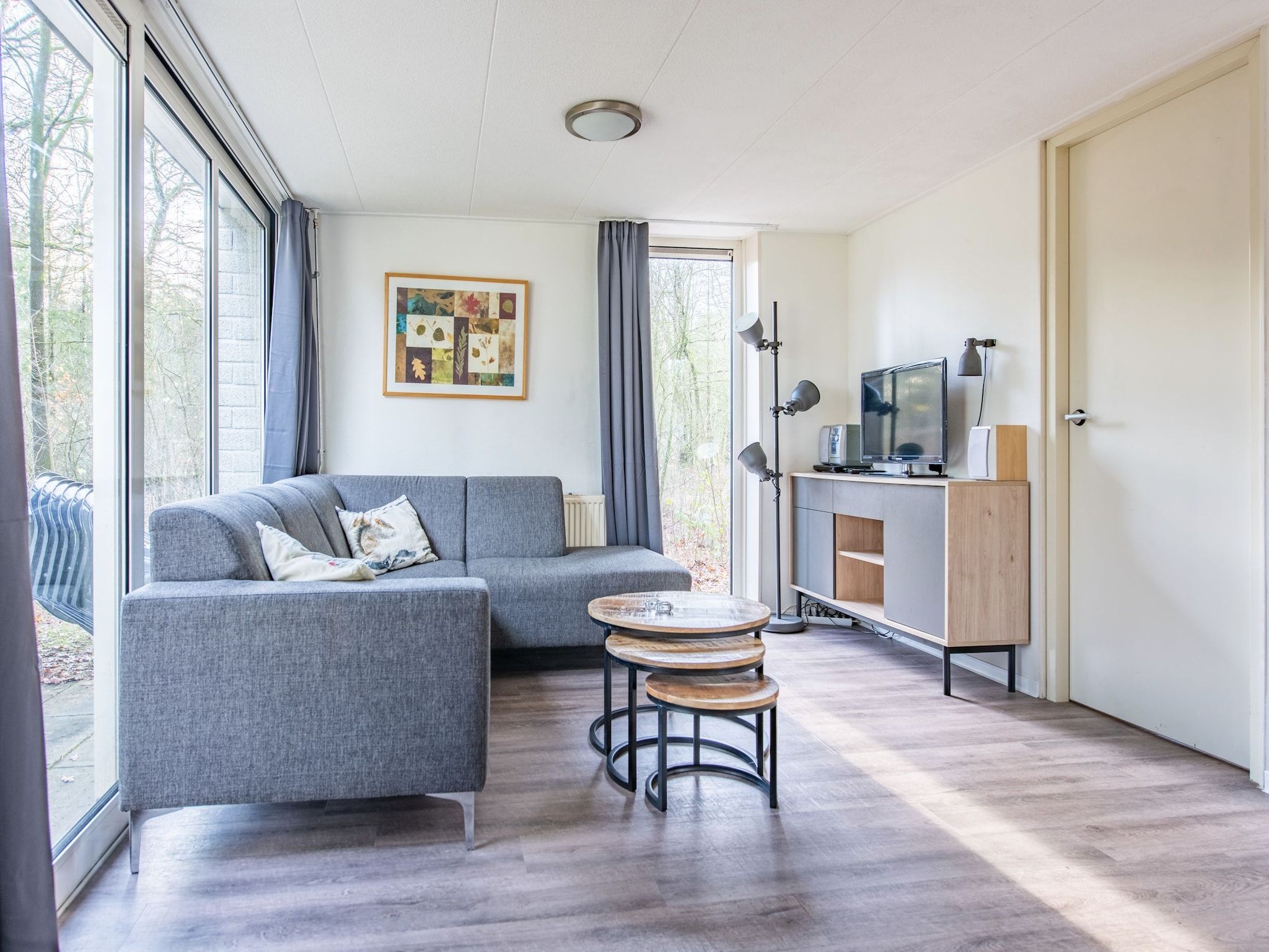 De woonkamer van Vakantiepark de Berkenhorst 11 in Kootwijk