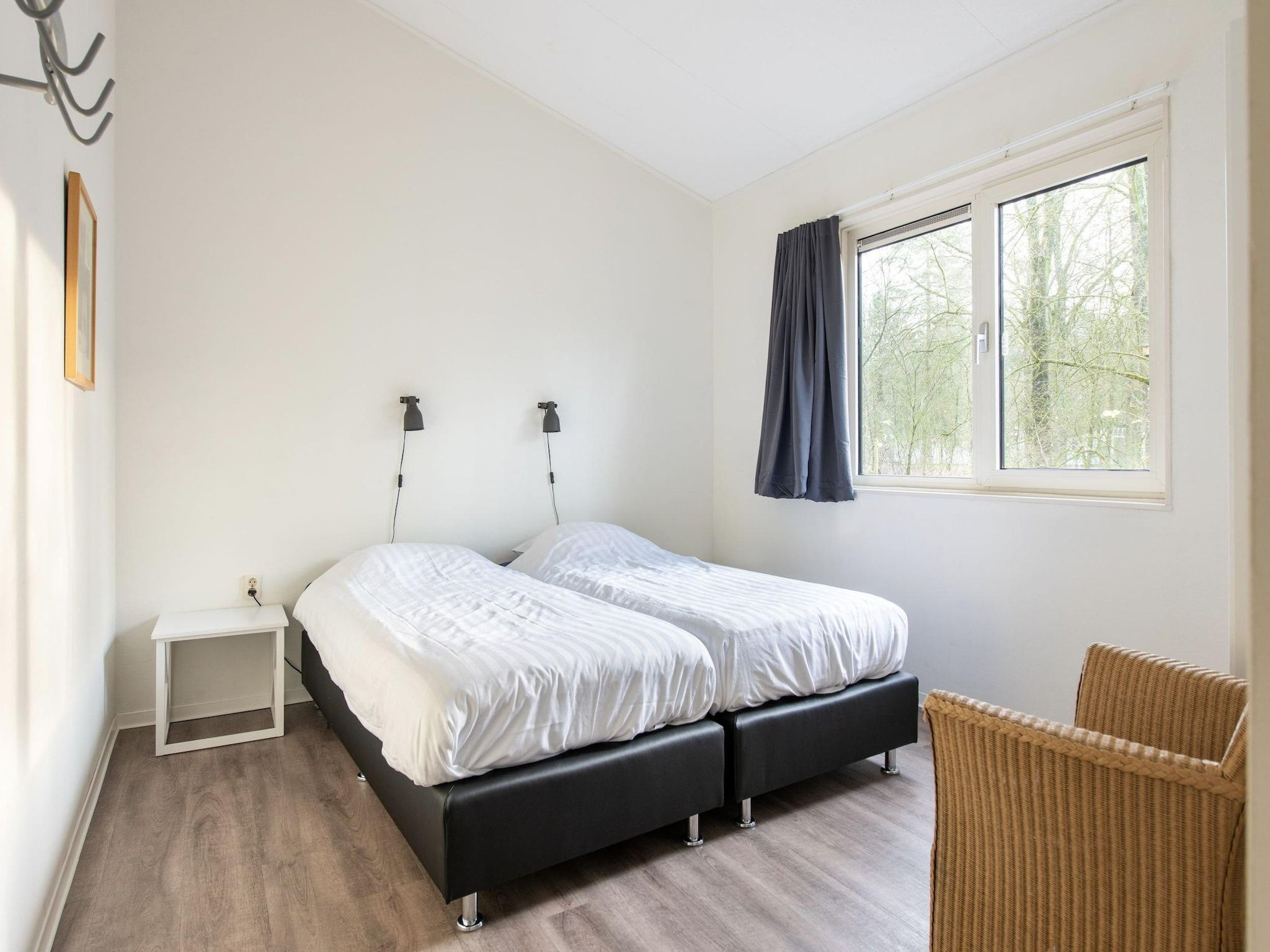 Een slaapkamer van Vakantiepark de Berkenhorst 11 in Kootwijk