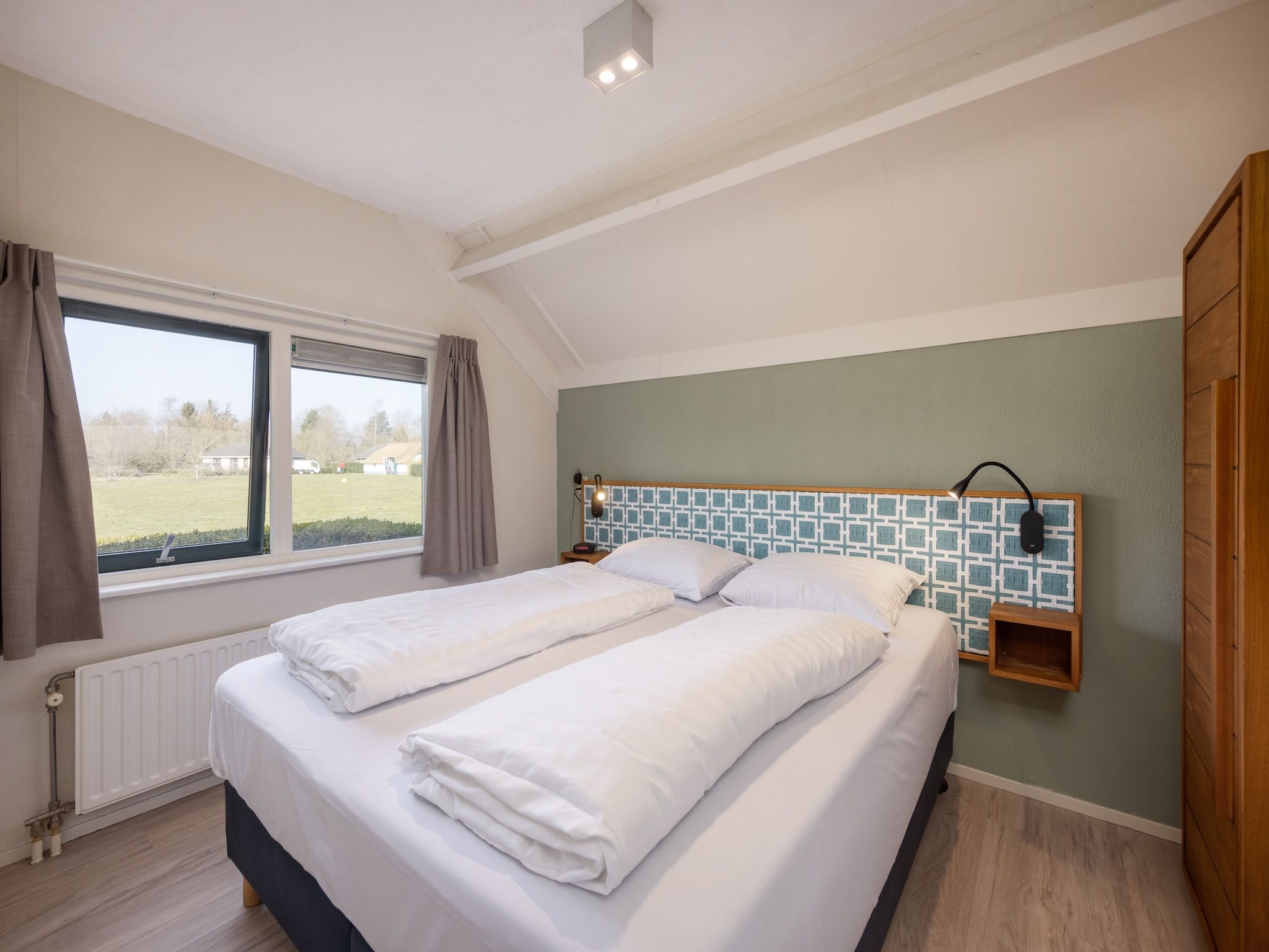 Een slaapkamer van De Veluwse Hoevegaerde 1 in Putten