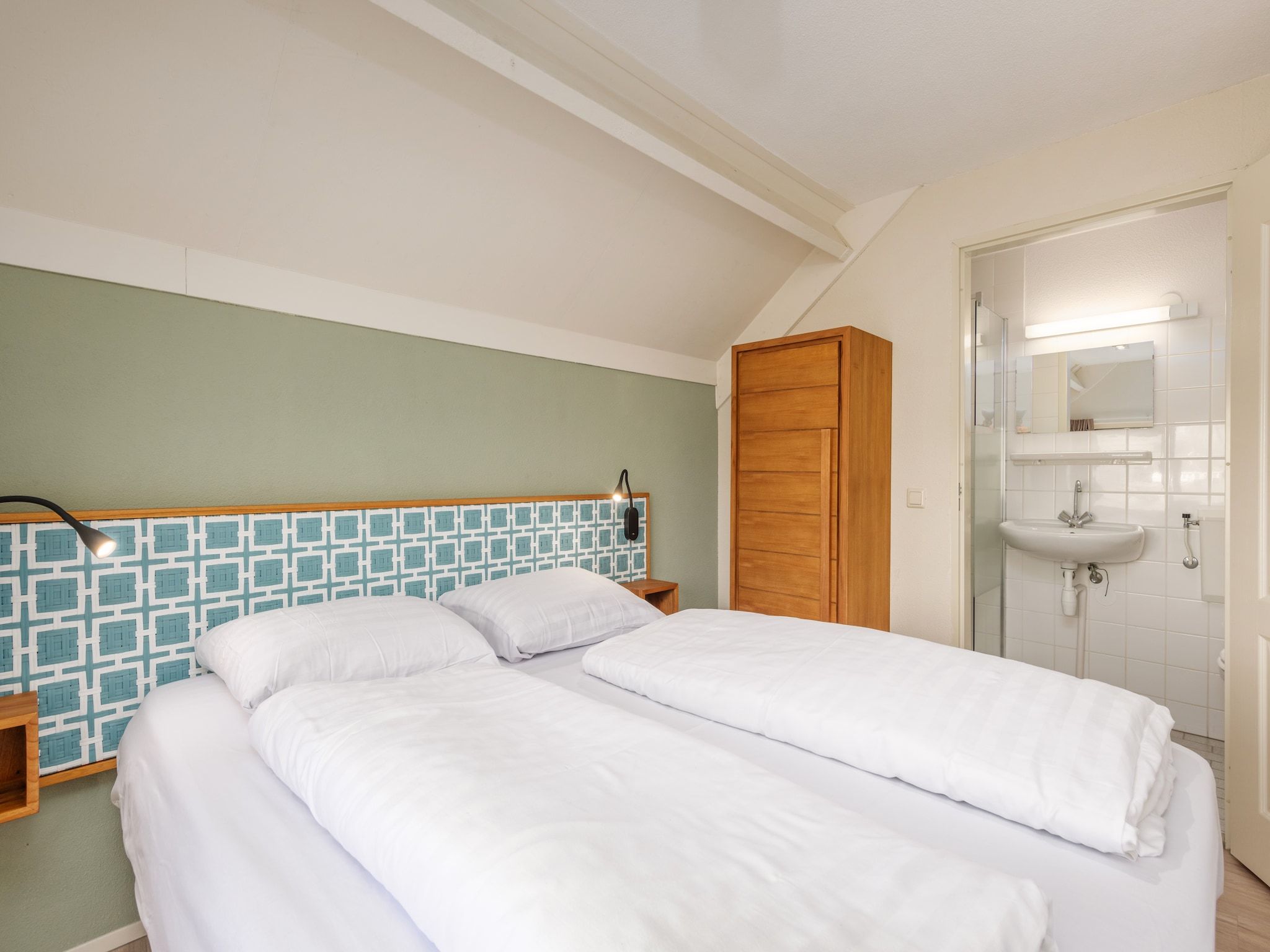 Een slaapkamer van De Veluwse Hoevegaerde 1 in Putten