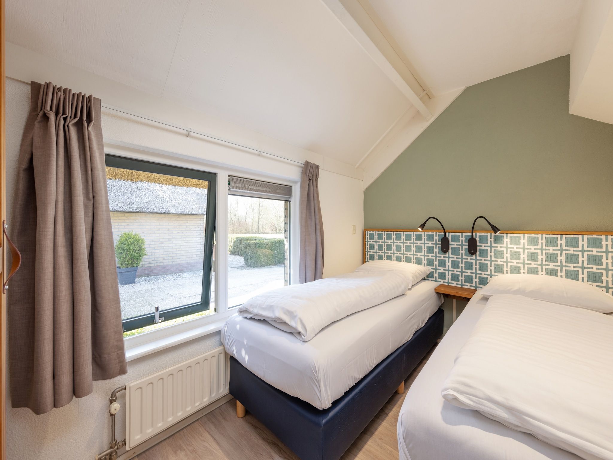 Een slaapkamer van De Veluwse Hoevegaerde 1 in Putten