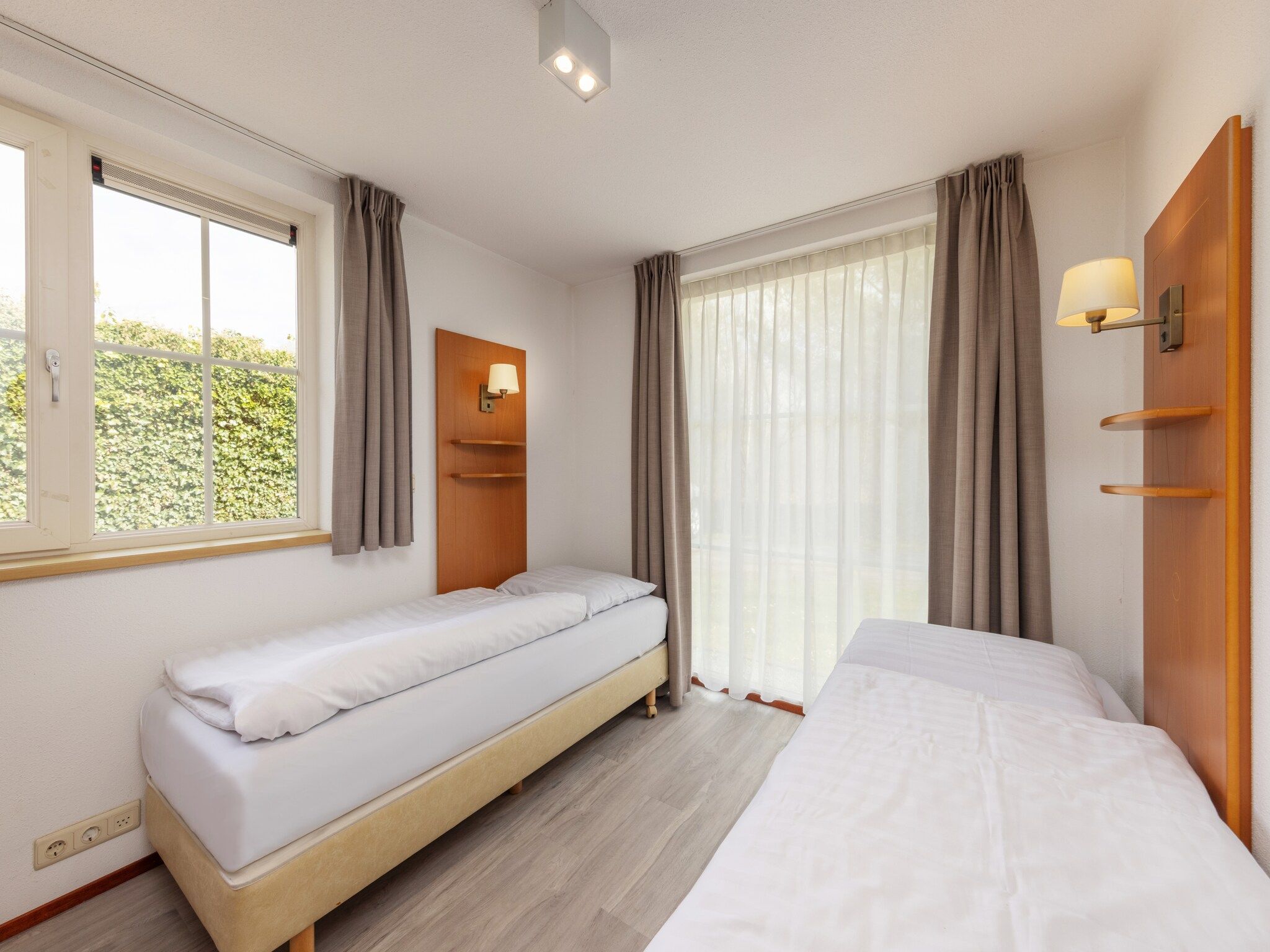 Een slaapkamer van De Veluwse Hoevegaerde 2 in Putten