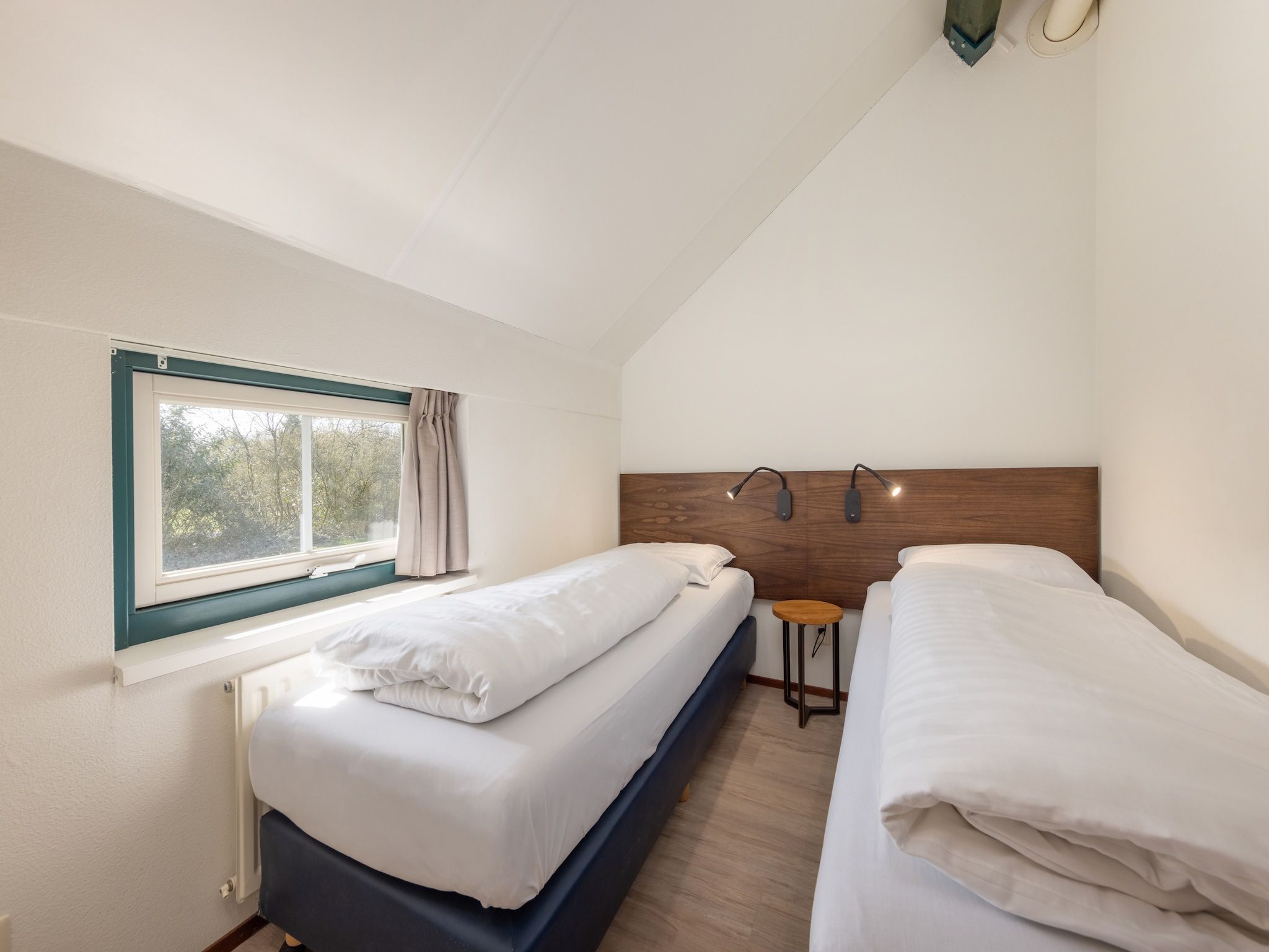 Een slaapkamer van De Veluwse Hoevegaerde 3 in Putten