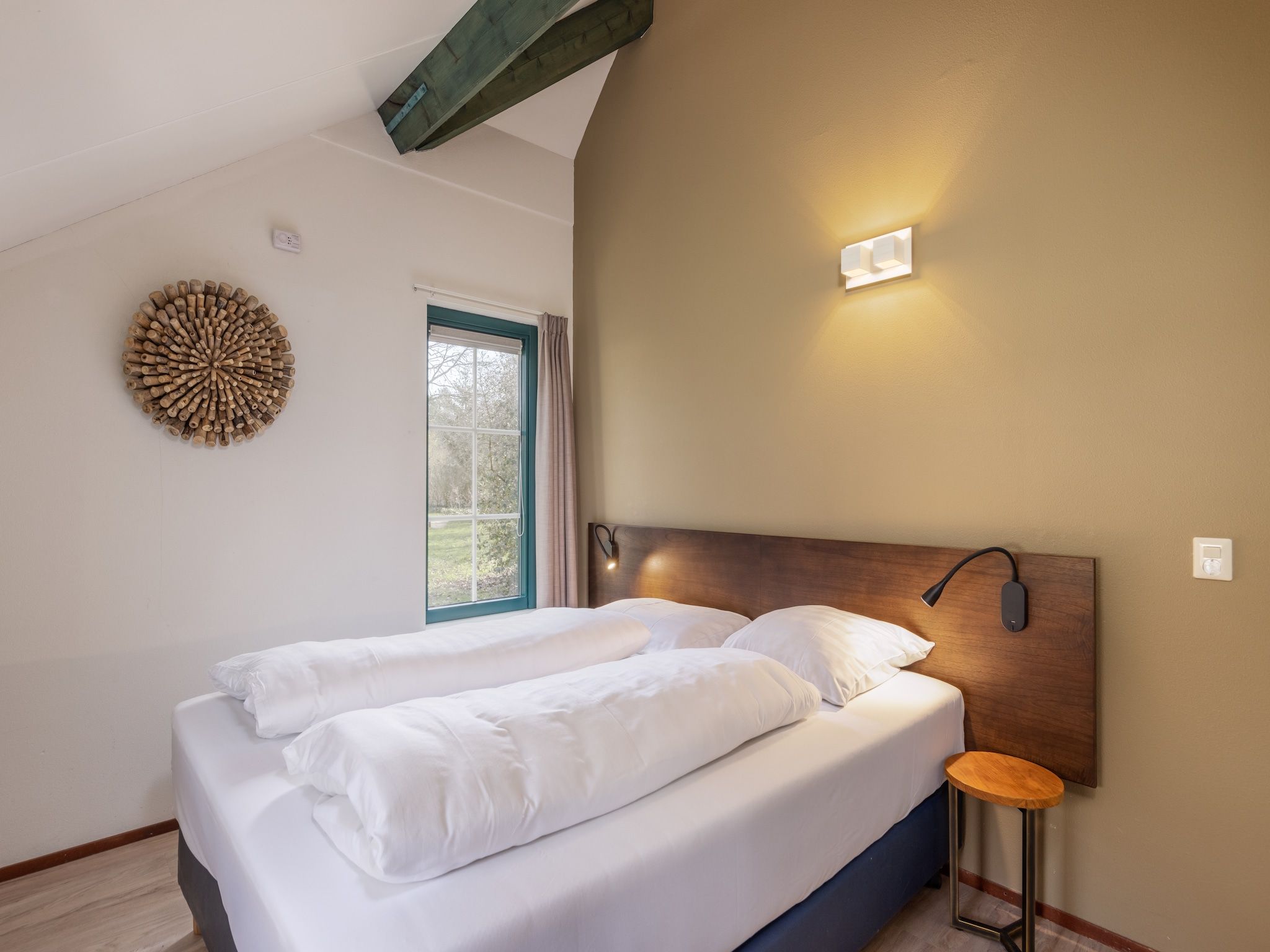 Een slaapkamer van De Veluwse Hoevegaerde 3 in Putten