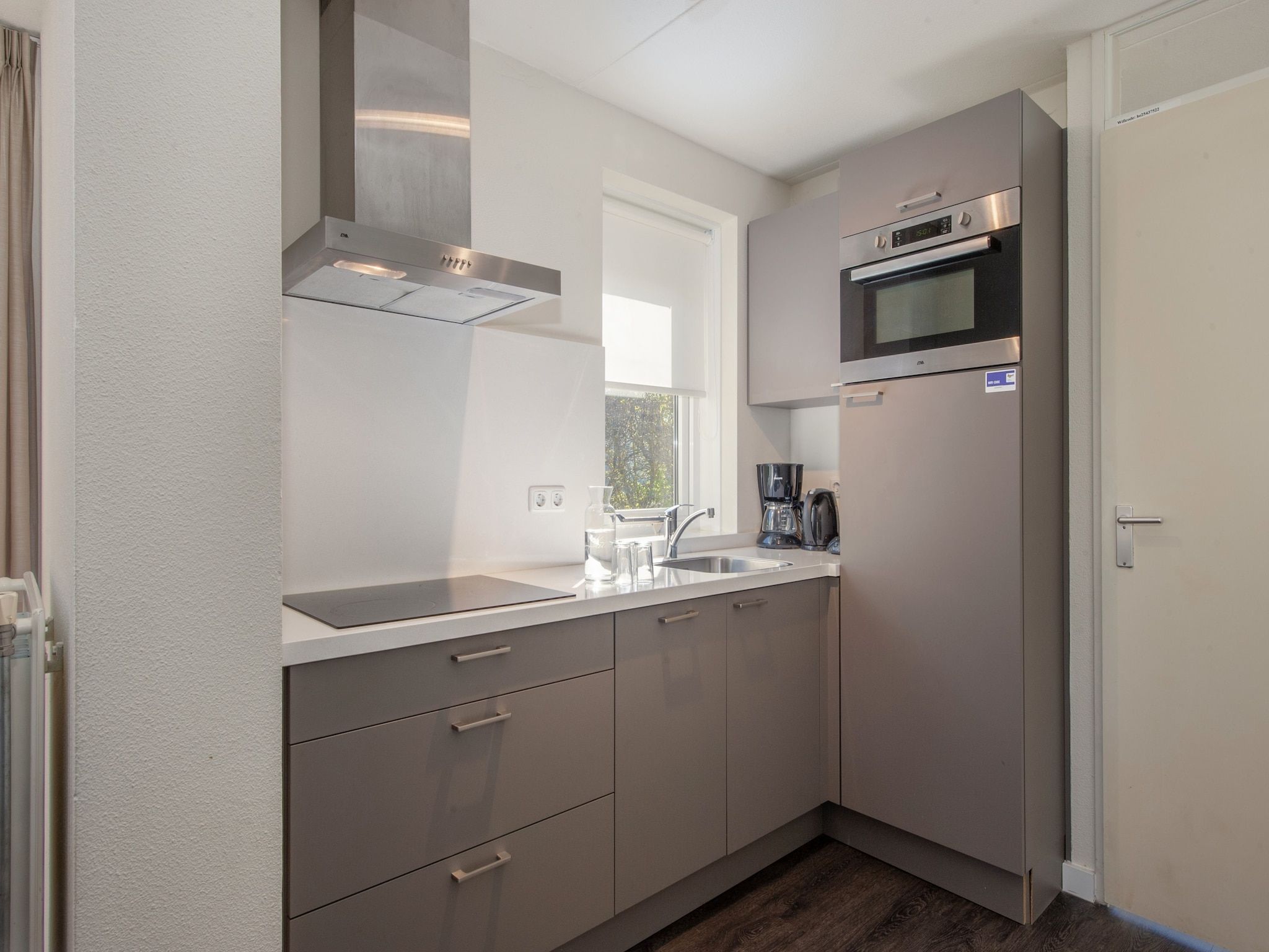 De keuken van Noordzee Résidence De Banjaard 18 in Kamperland