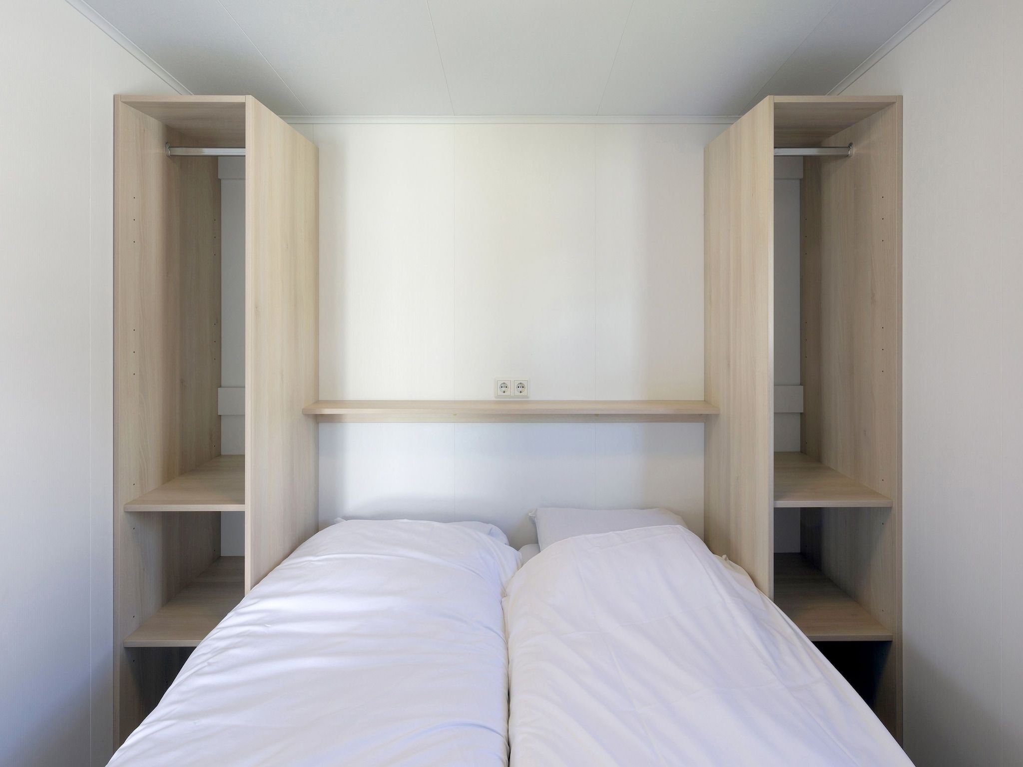 Een slaapkamer van Vakantiepark Beach Resort 22 in Kamperland