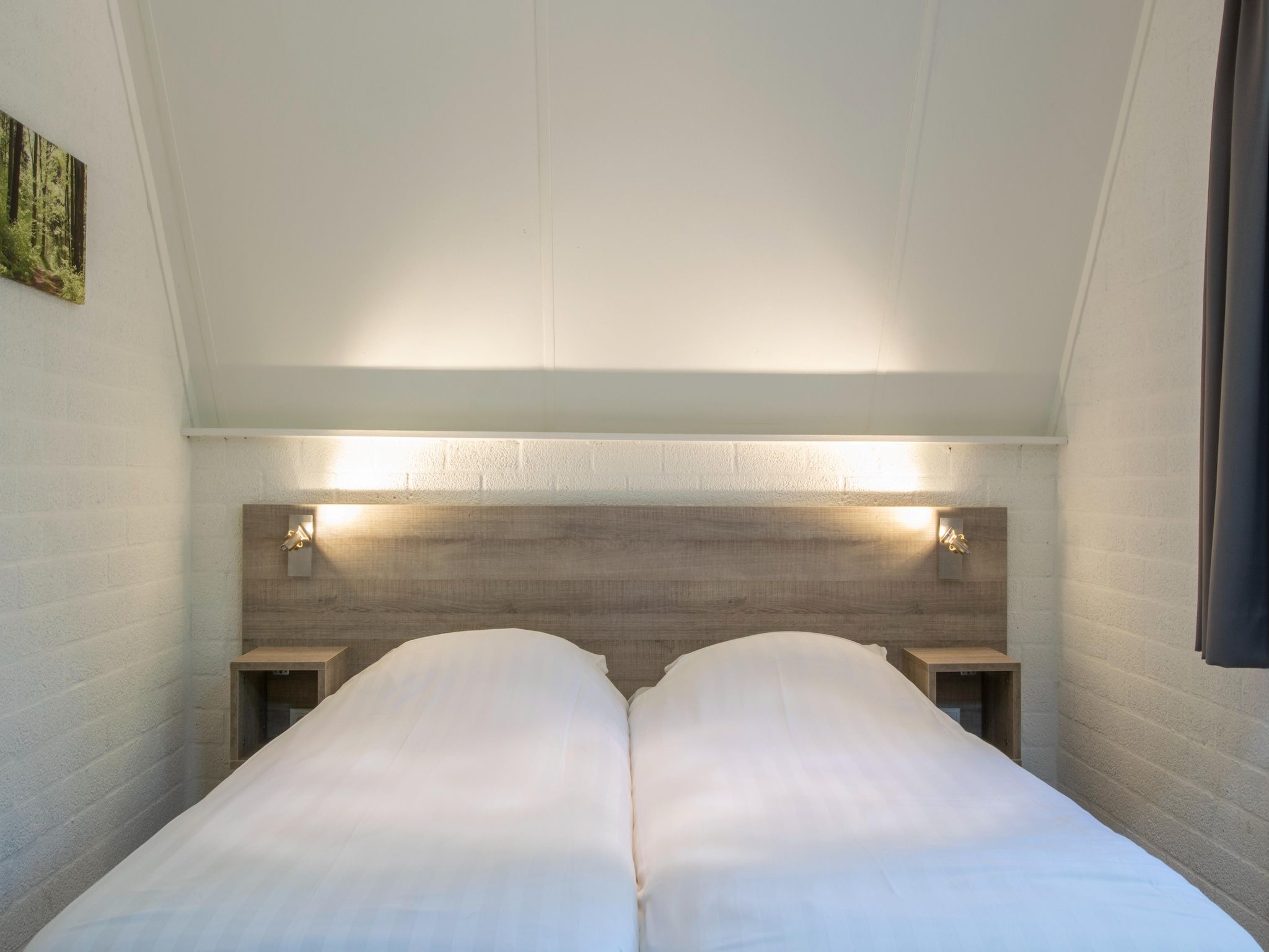 Een slaapkamer van Vakantiepark de Katjeskelder 15 in Oosterhout