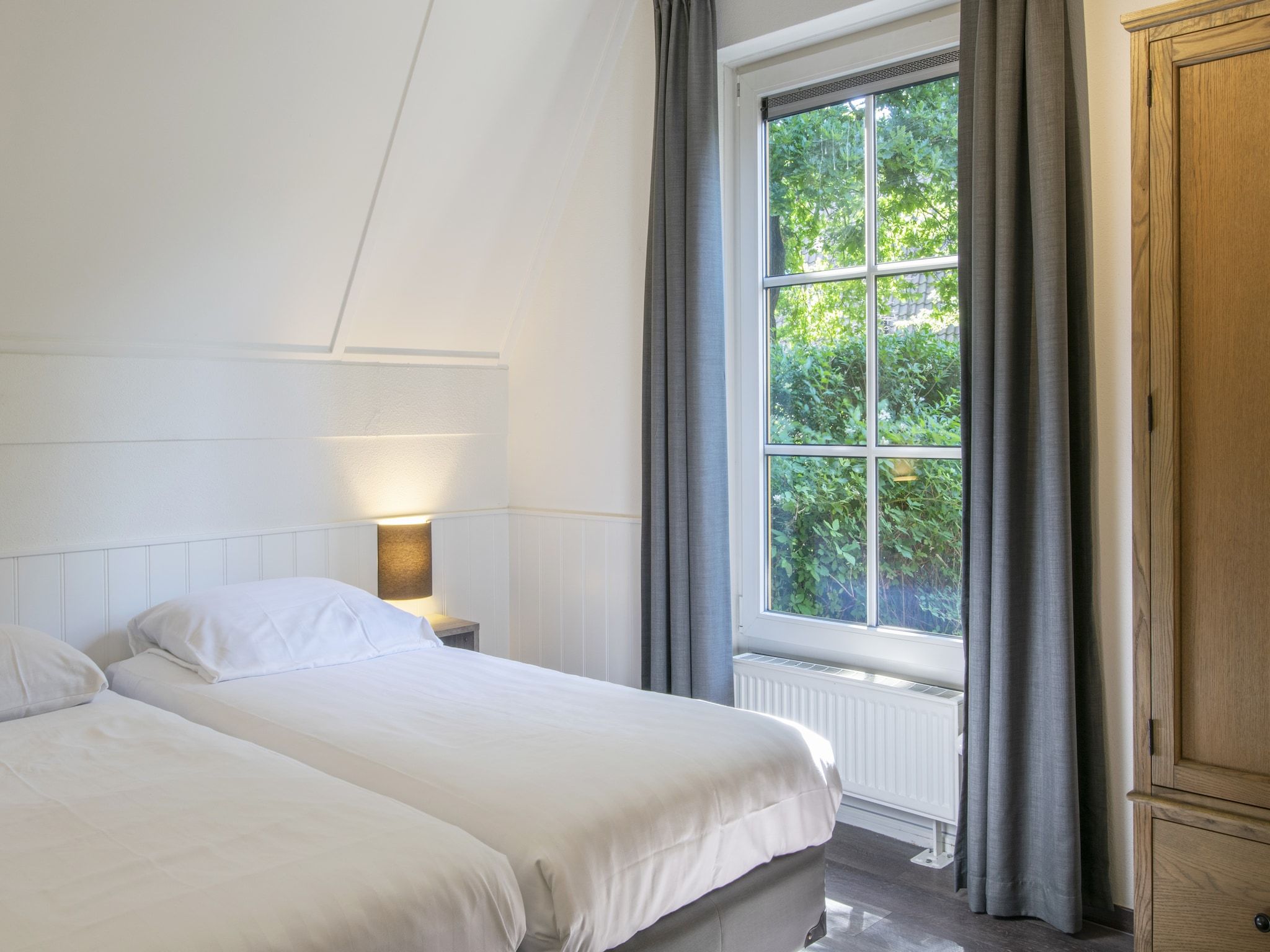 Een slaapkamer van Vakantiepark de Katjeskelder 16 in Oosterhout