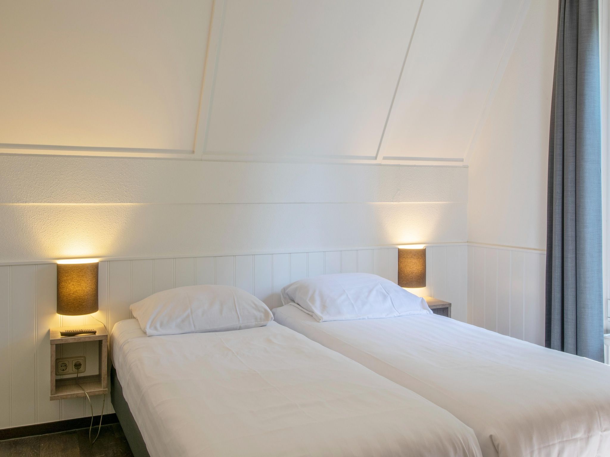 Een slaapkamer van Vakantiepark de Katjeskelder 16 in Oosterhout