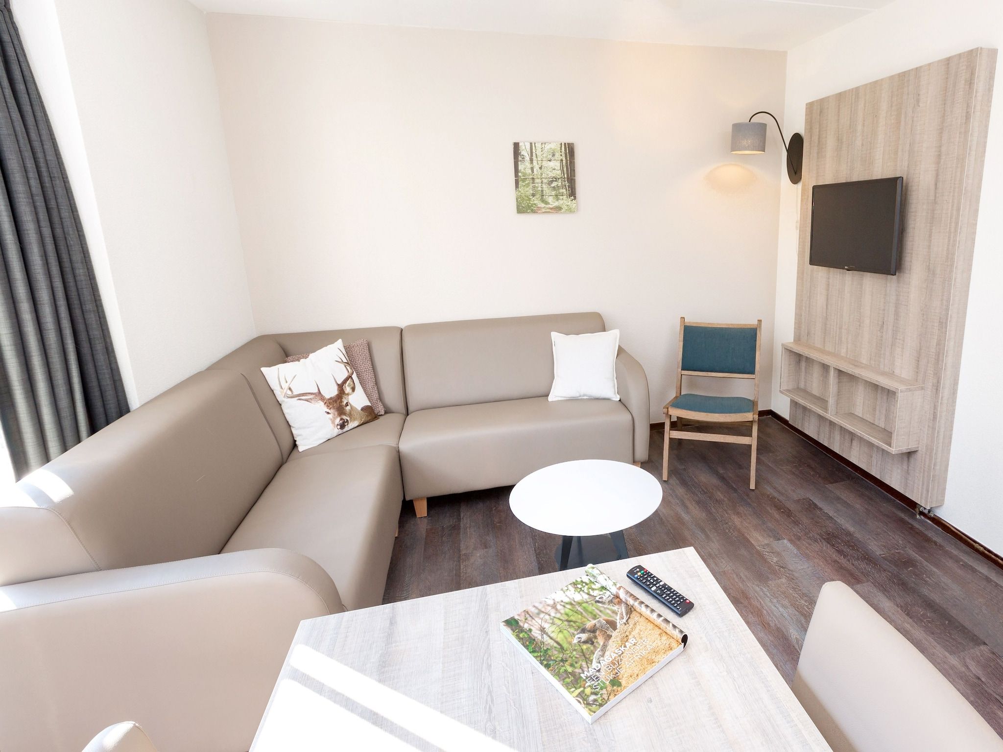 De woonkamer van Vakantiepark de Katjeskelder 17 in Oosterhout