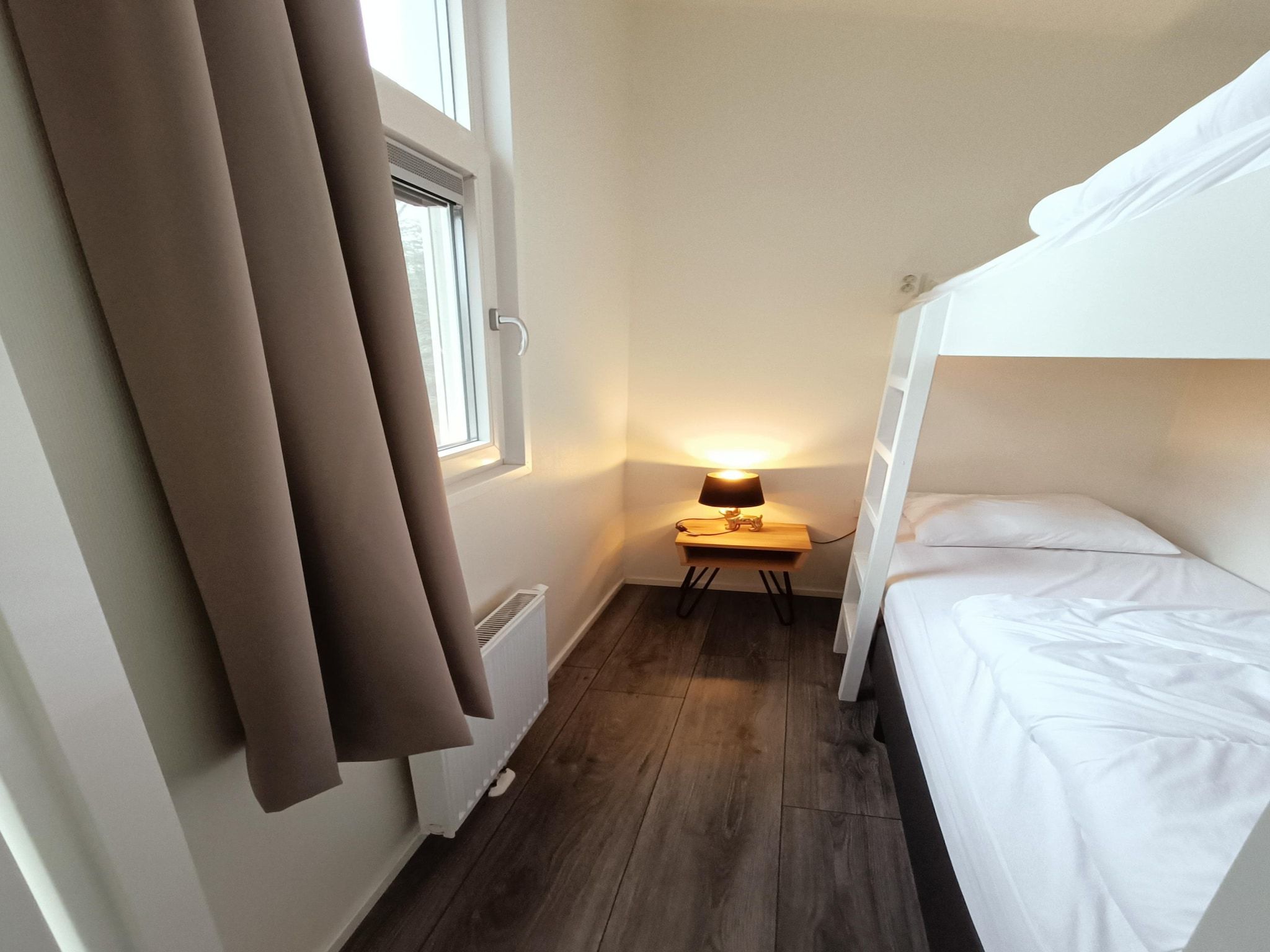 Een slaapkamer van Vakantiepark De Rimboe & De Woeste Hoogte 22 in Hoenderloo