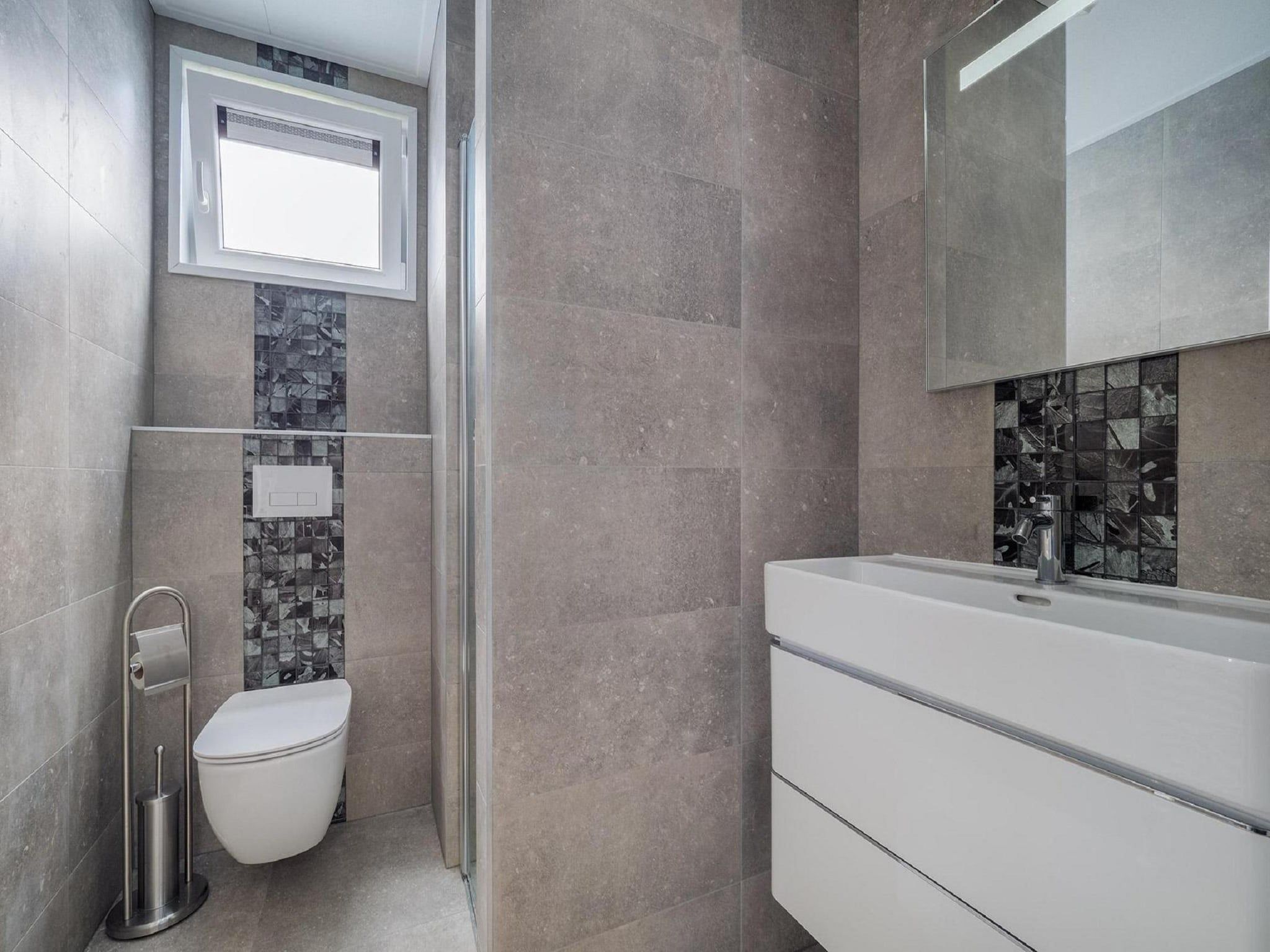 De badkamer van Vakantiepark De Rimboe & De Woeste Hoogte 24 in Hoenderloo