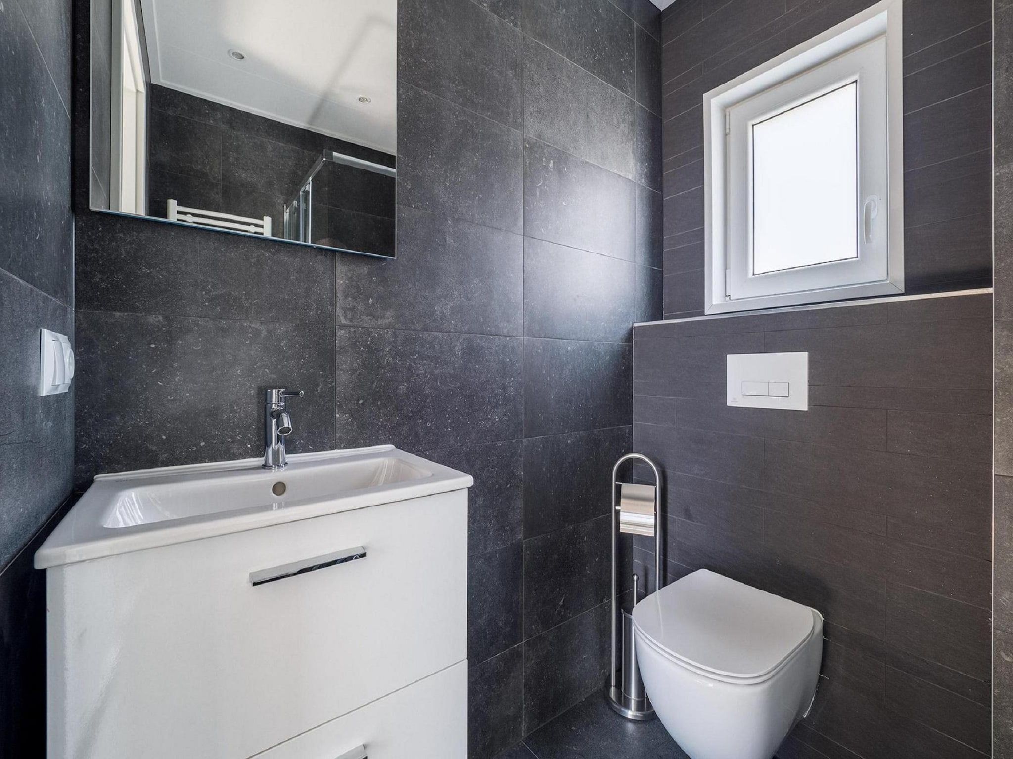 De badkamer van Vakantiepark De Rimboe & De Woeste Hoogte 24 in Hoenderloo