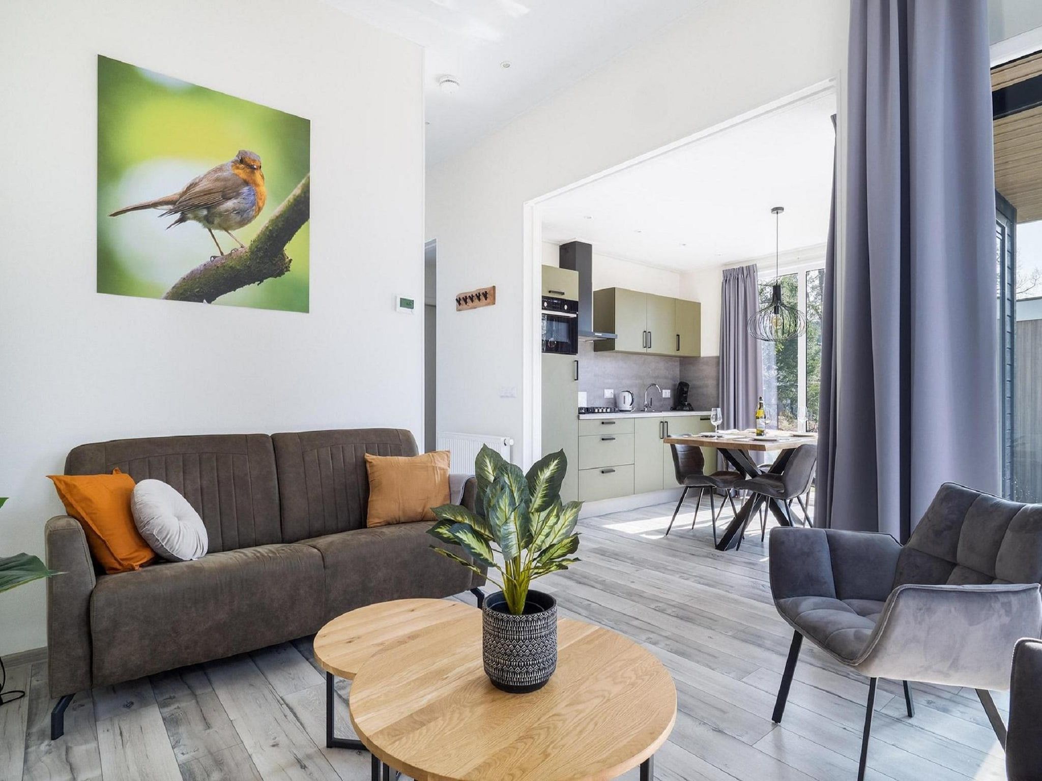 De woonkamer van Vakantiepark De Rimboe & De Woeste Hoogte 24 in Hoenderloo