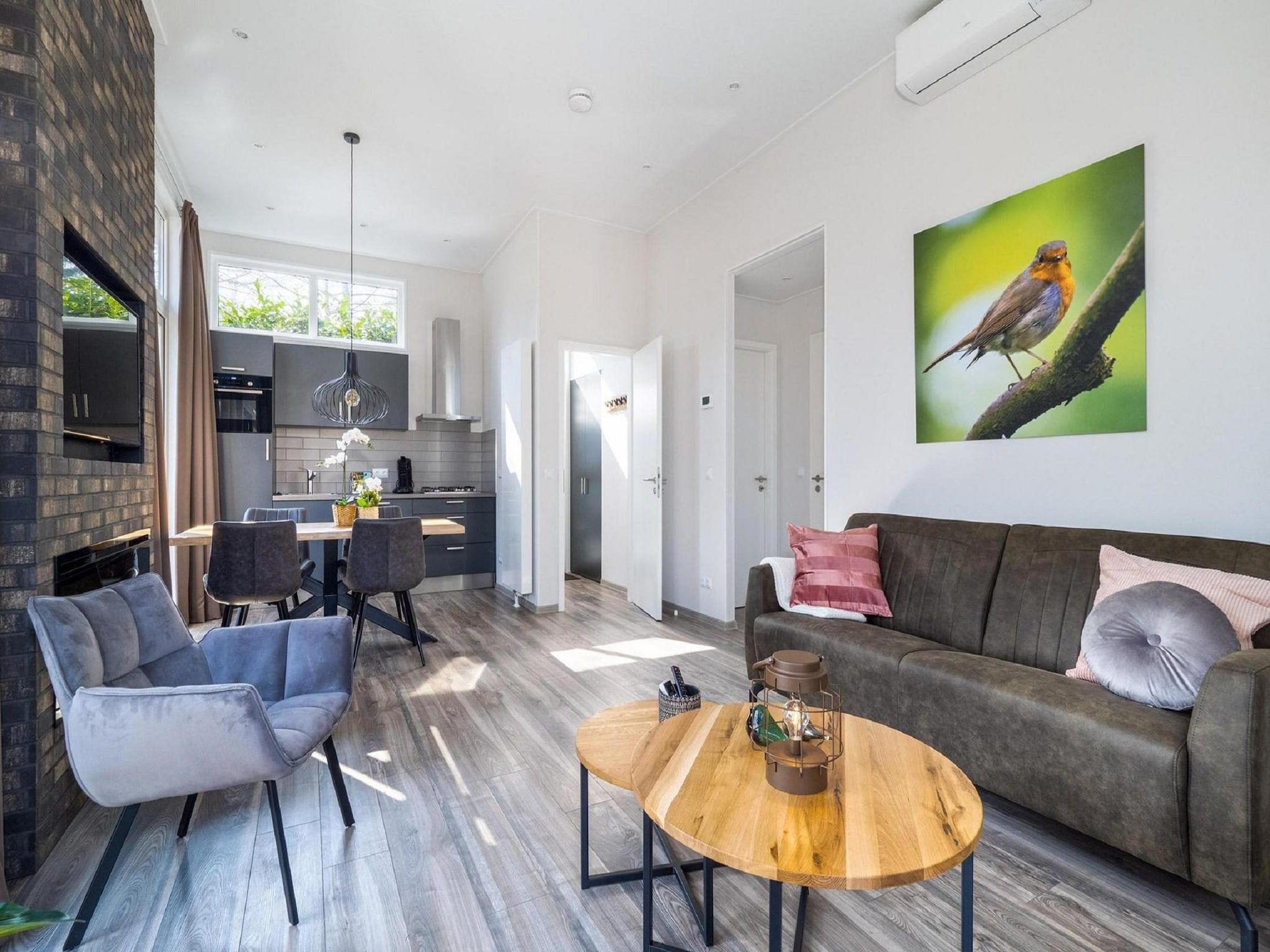 De woonkamer van Vakantiepark De Rimboe & De Woeste Hoogte 24 in Hoenderloo