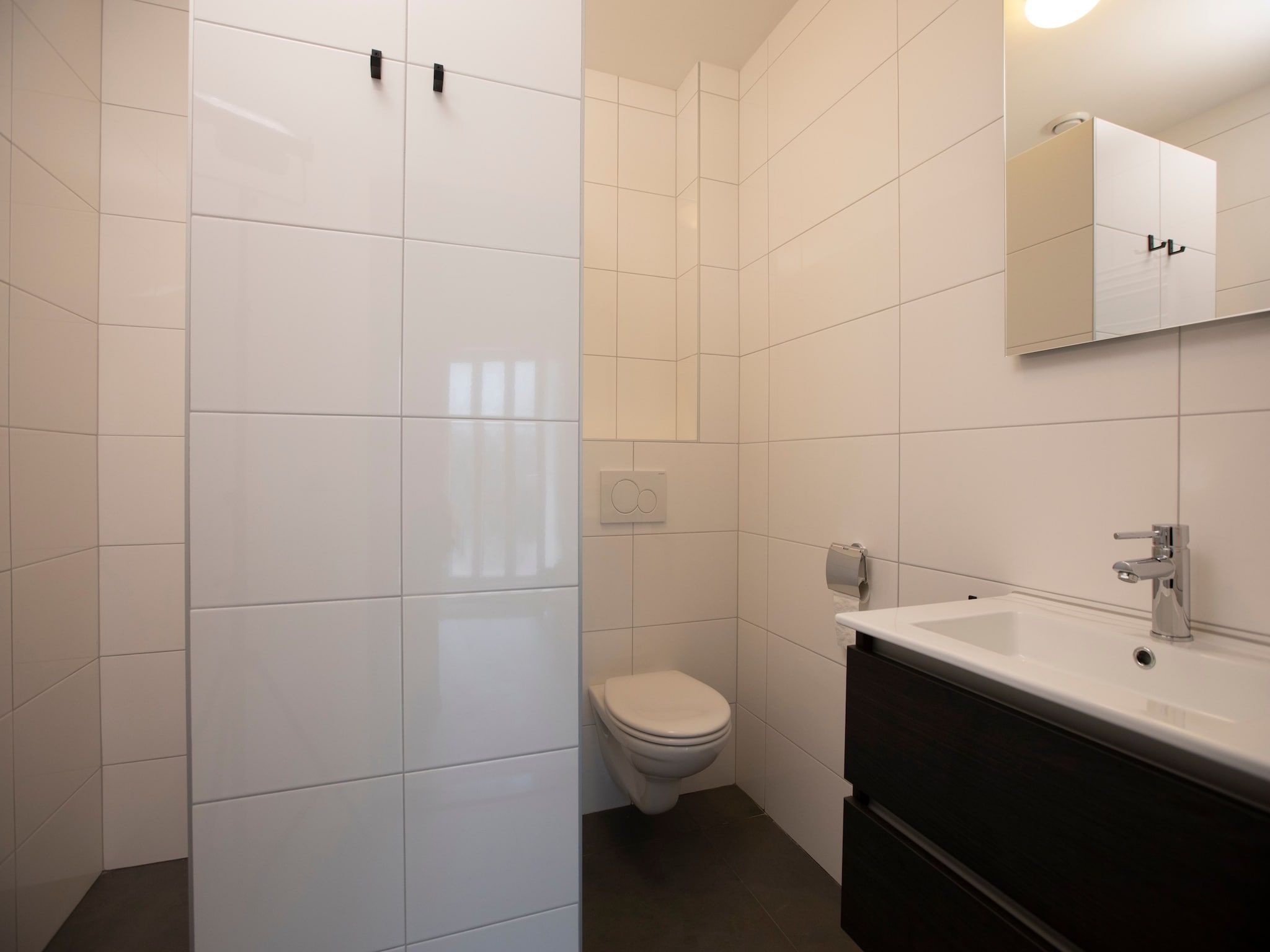 De badkamer van Vakantie bij Meeussen - Schuttersoord 3 in Mook