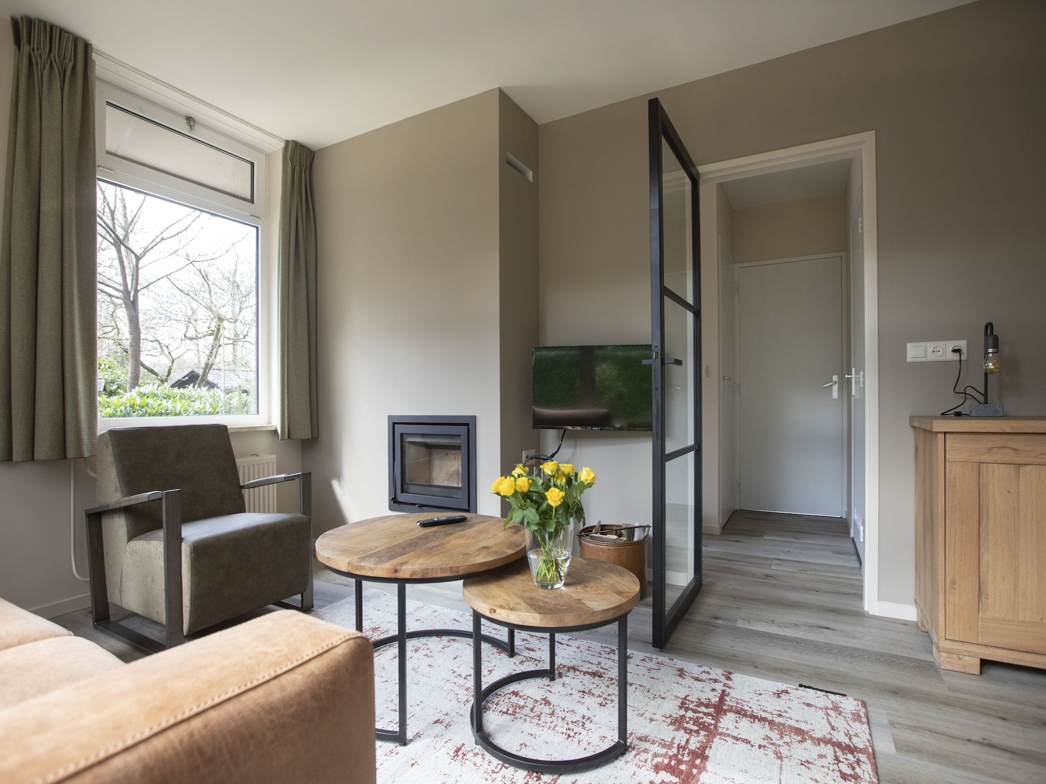 De woonkamer van Vakantie bij Meeussen - Schuttersoord 3 in Mook