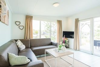 Stijlvol chalet vlakbij het strand in Hollum