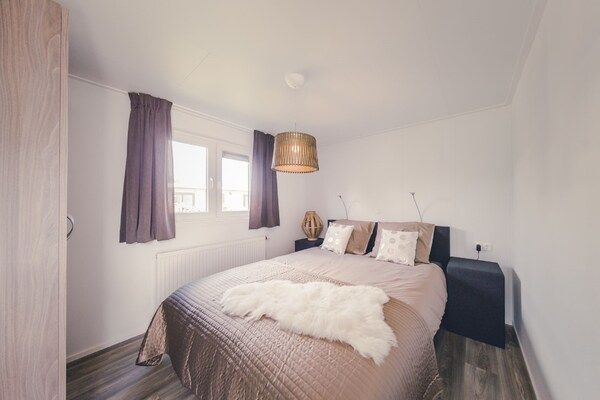 Slaapkamer - Gezellig chalet met tuin in Rijssen (2)