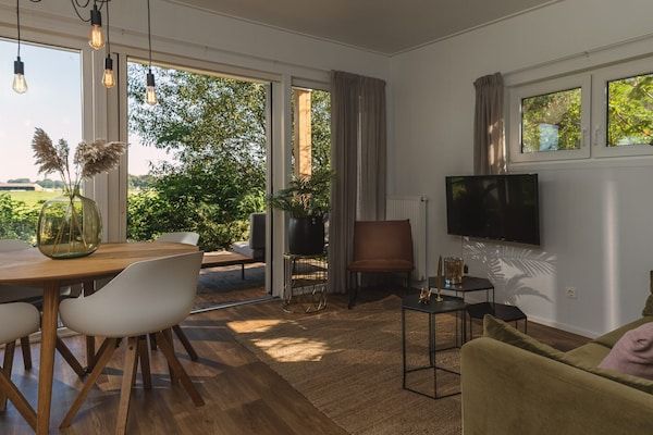 Woonkamer - Prachtige lodge aan de rivier met panoramisch uitzicht in Zuna (5)