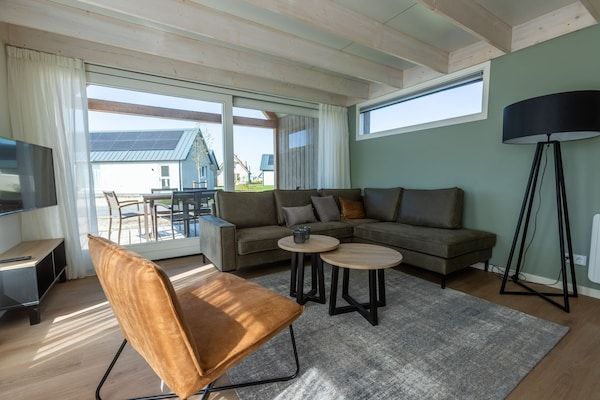 Woonkamer - Duinlodge op vakantiepark, strand op 1,3 km in Cadzand (2)